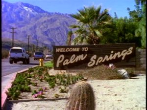 stock-footage-welcome-to-palm-springs-sign-along-highway-leading-to-palm-springs